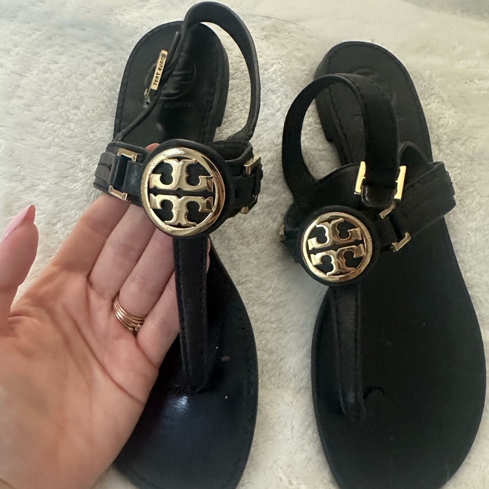 Tory Burch Black and Gold Sandals with Signature Medallion